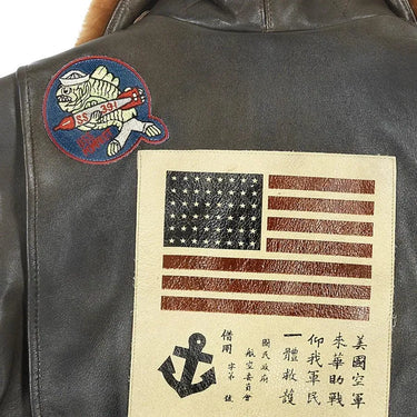 Close-up of the back patches showing American flag, anchor, and Air Force fish emblem.