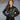 Female model wearing Cockpit USA Women’s WASP A-2 Flight Jacket with hands in pockets