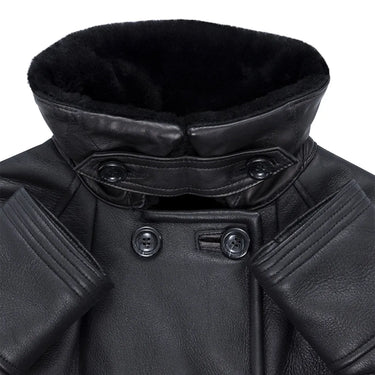 Detailed view of the standing collar on the Woodland Sheepskin Trench showing thick black shearling lining