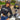 Woman wearing Legendary USA Booty Call cropped hoodie, front view with logo text, standing beside classic motorcycle