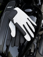 ILLEST DOZER White Outseam Gloves shown in a riding setting made in USA, a motorcycle glove