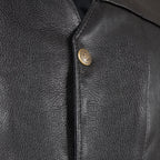 Close-up of pebbled leather and snap button detail on Legendary Dixon men’s motorcycle vest, made in USA