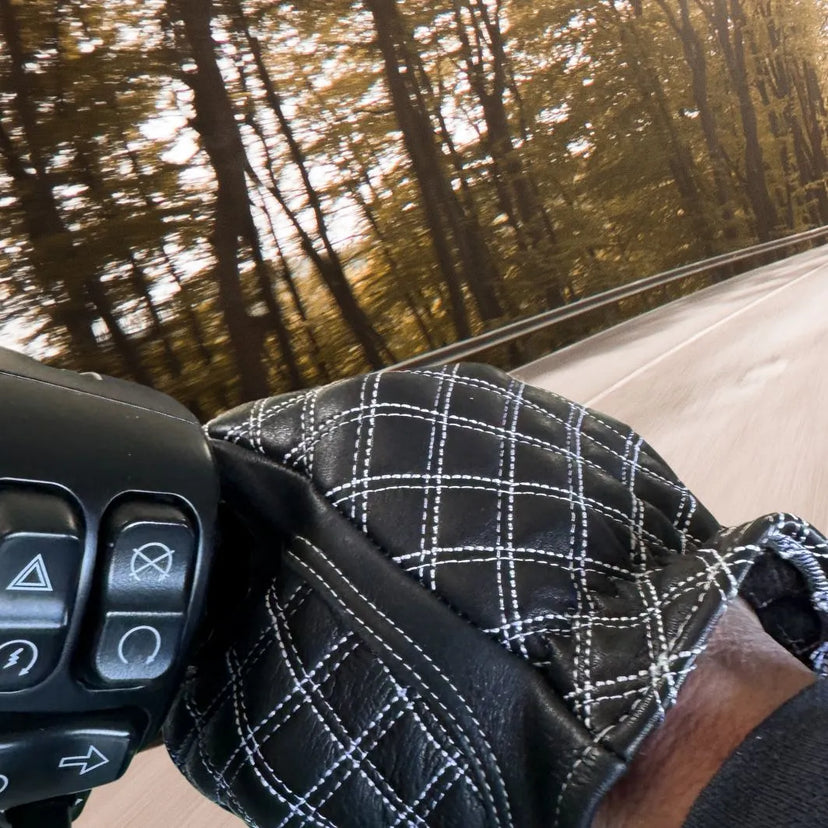 Close-up of Legendary Double-Diamond White Stitch Gloves while riding through forest road, showing grip and craftsmanship, made in USA