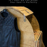 Legendary USA leather tumbling service showing black leather vest hanging on custom wooden break-in drum labeled Legendary Time Machine