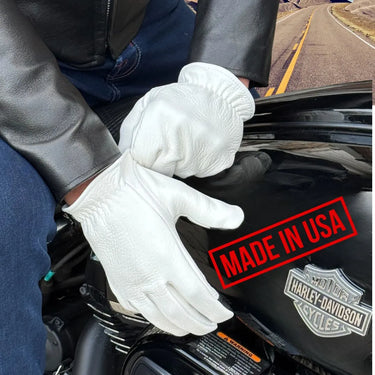 Rider wearing Legendary The Cadbury white leather motorcycle gloves holding Harley-Davidson tank, made in USA