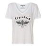 Front view of the Legendary USA Women's Chill Out Biker Chick Shirt in white with skull wing graphic and gothic lettering, Made in USA