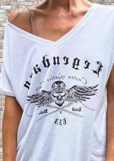 Close-up lifestyle image of a woman wearing the Legendary USA Chill Out Biker Chick Shirt off the shoulder, showing relaxed fit and edgy graphic, Made in USA