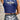 Lifestyle image showing back view of navy tank on model, highlighting cropped fit and graphic design