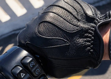 Rear view of Legendary short wrist black deerskin gloves, with hardware and stitching visible