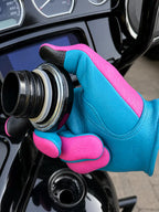 Spitfire Neon Blue/Pink Gloves shown in a riding setting made in USA, a motorcycle glove